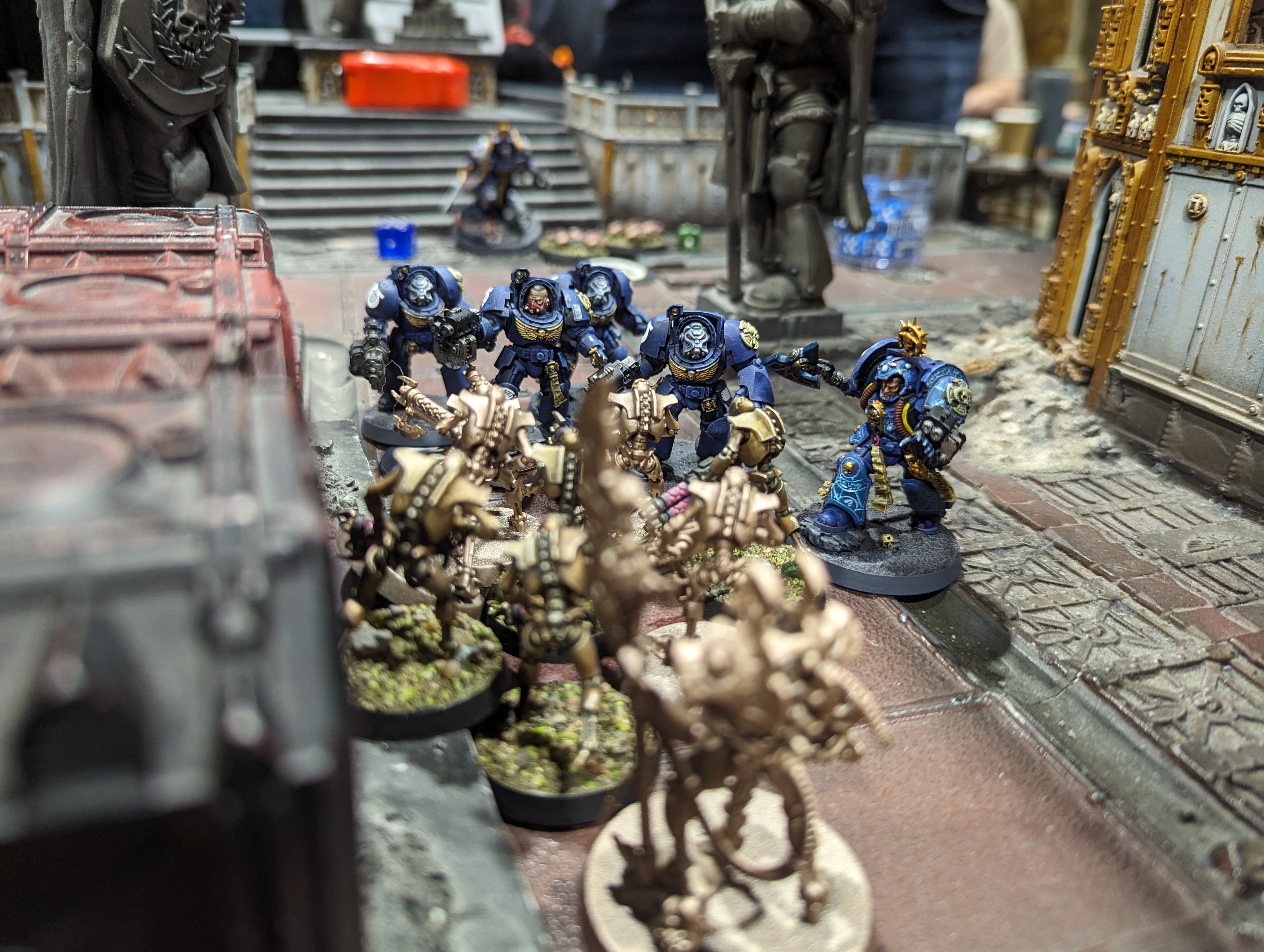 A Necron unit of Warriors faces death in the form of a unit of Ultramarine terminators that have just charged in.